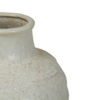 Close-up of the ivory vase's rolled rim, smooth short neck and textured shoulder with brown speckles.