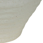 Close-up of the vase's tapered lower body showing shallow horizontal bands and scattered earthy speckles.