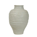 Front view of an ivory speckled vase with rounded shoulders, horizontal ridges and a tapered base on a white background.