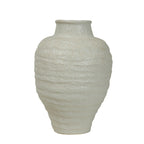 Front view of an ivory speckled vase with rounded shoulders, horizontal ridges and a tapered base on a white background.