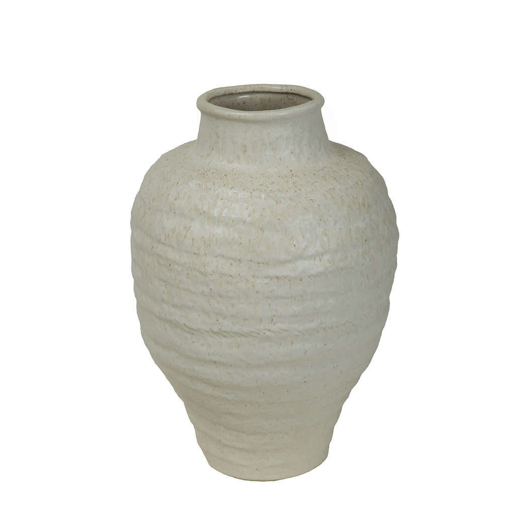 Angled view of the ivory ceramic vase showing its open neck, rolled rim and irregular bands around the body.