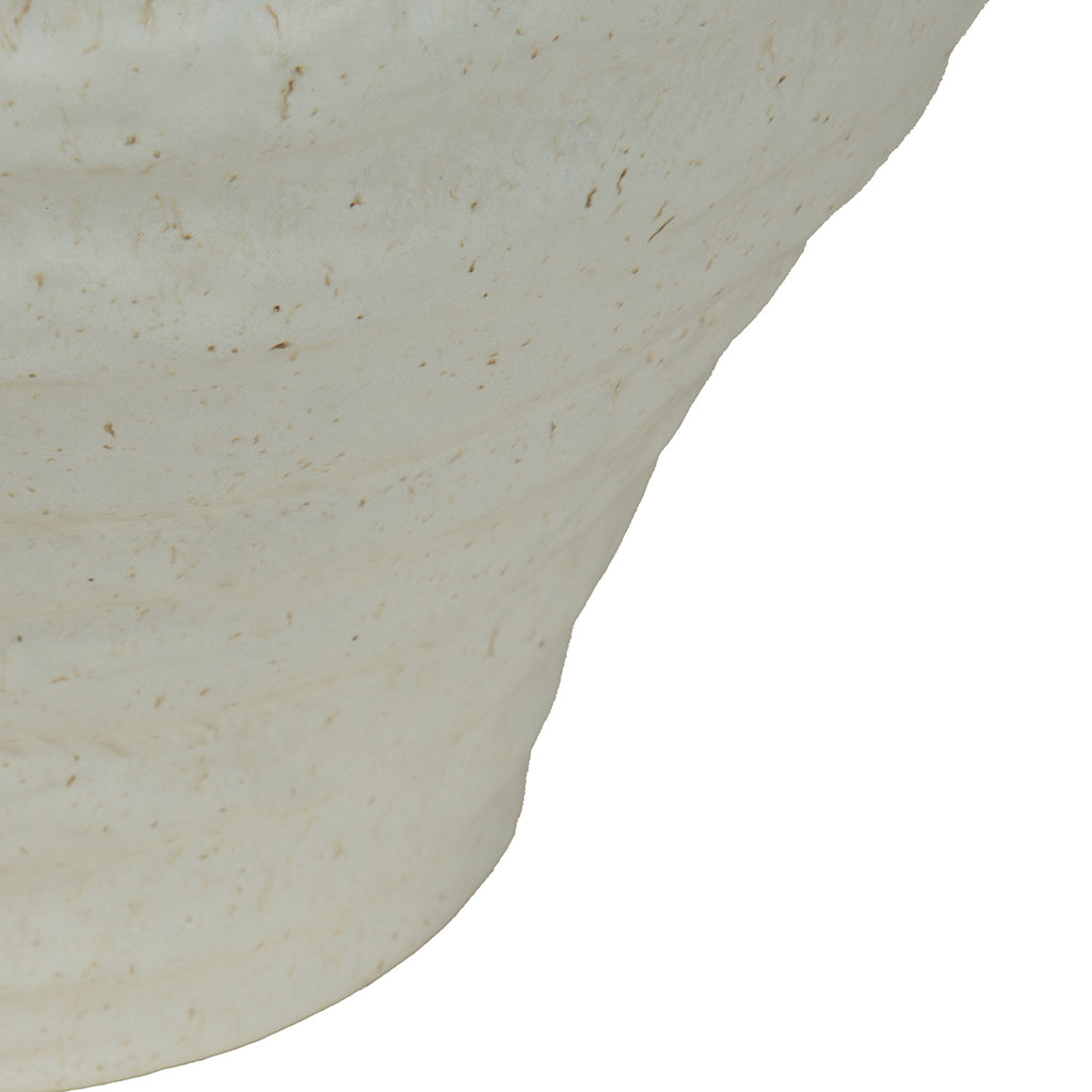 Close-up of the tapered lower body showing uneven horizontal ridges and natural-toned speckles in the pale glaze.
