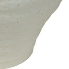 Close-up of the tapered lower body showing uneven horizontal ridges and natural-toned speckles in the pale glaze.