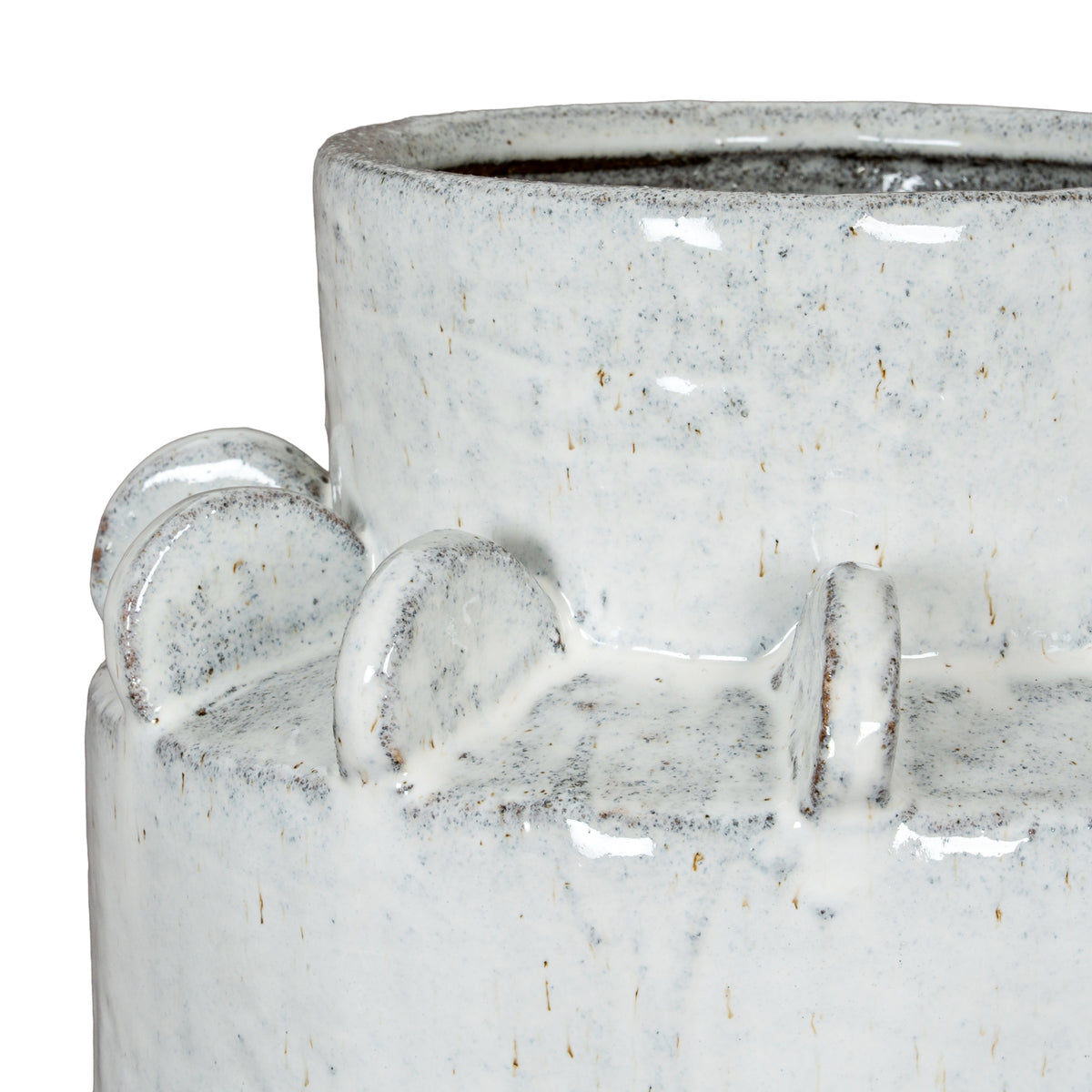 Close-up of the vase's rounded shoulder fins and raised neck, with grey speckles and brown flecks in the pale glossy glaze.