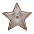 Overhead view of an empty warm off-white star candle holder with five upturned points, speckled edges and a central round socket.