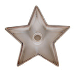 Overhead view of an empty warm off-white star candle holder with five upturned points, speckled edges and a central round socket.