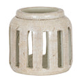 Rounded cream candle holder with brown speckles, a broad raised rim and tall rectangular openings around the body.