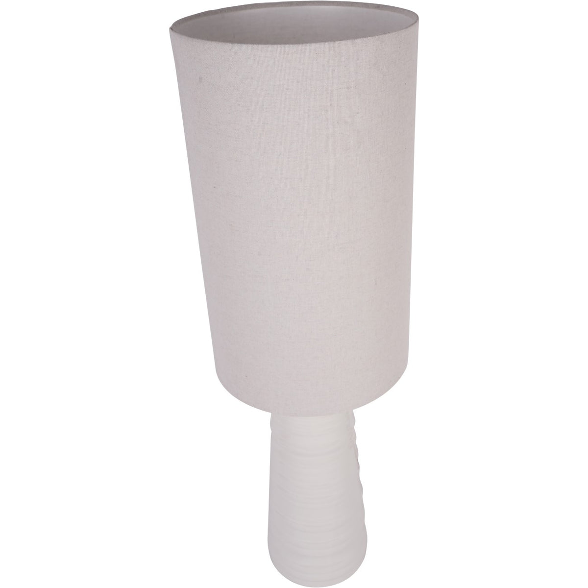 Spindle table lamp viewed from above, showing the open top of its tall linen shade and white base below.