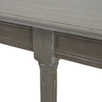 Close-up of the console's grey tabletop edge, moulded apron and the ringed detail at the top of a leg.