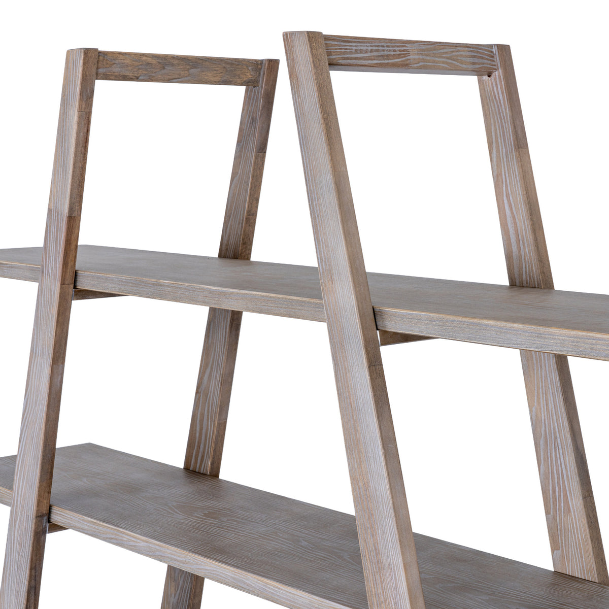Close view of the shelving unit's upper frames and shelves, showing pale grain markings along the angled lines.