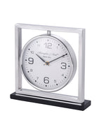 Angled view of the mantel clock showing the depth of its polished square frame and circular dial casing.