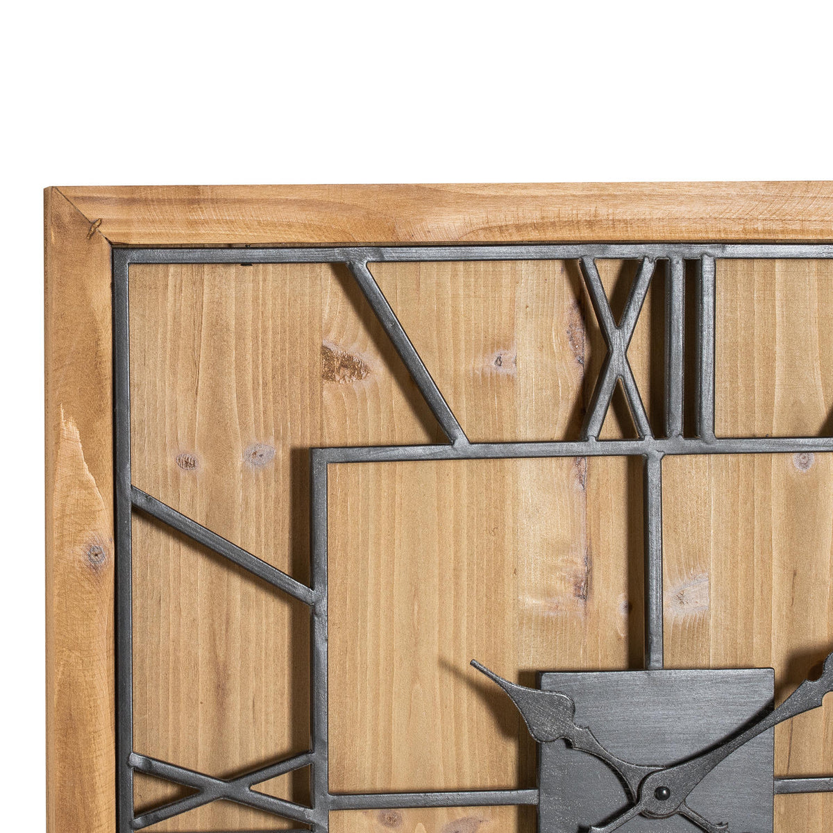 Close-up of the clock's upper left corner, showing grain patterns and knots behind the dark open numerals and square framework.