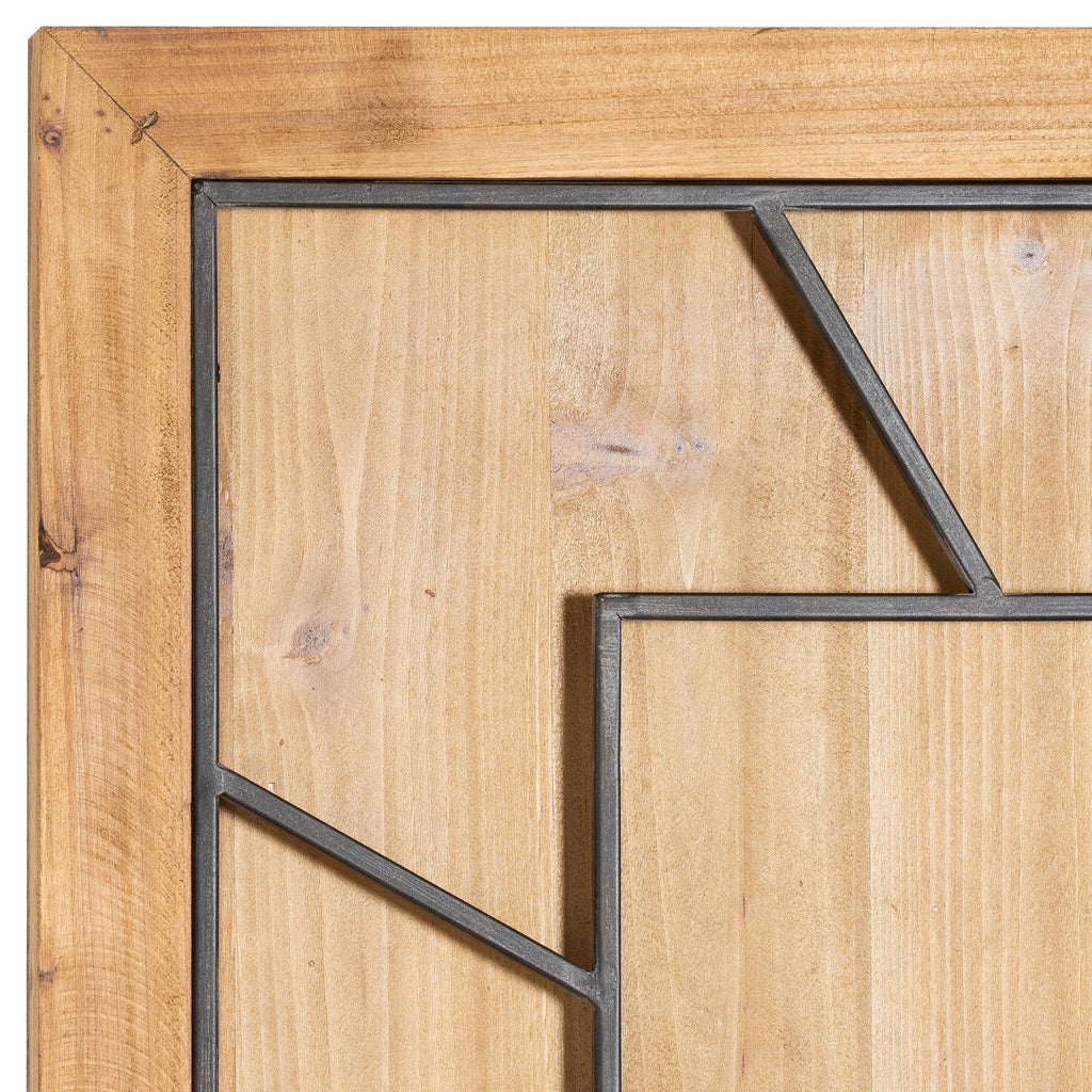 Close-up of the clock's upper-left corner, showing the honey-brown surround, grain-patterned face and dark numeral framework.