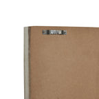 Close-up of the clock's brown rear backing and whitewashed frame edge, with a silver-coloured sawtooth hanger secured by two screws.