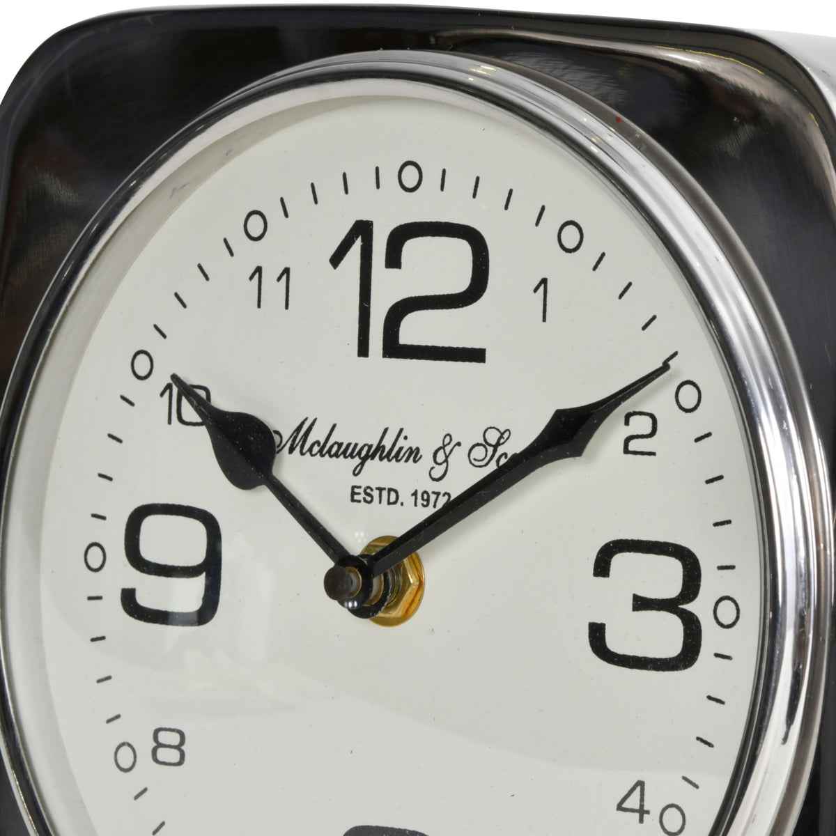 Close-up of the upper clock face, showing the large twelve, black hands, small hour numerals and silver dial surround.