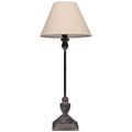 Square Plinth Table Lamp against white, showing its pale tapered shade, long dark stem and shaped grey-washed base.