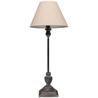 Square Plinth Table Lamp against white, showing its pale tapered shade, long dark stem and shaped grey-washed base.