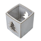 View down into the square candle holder showing the tan-lined rim, interior and tree-shaped openings on opposite faces.
