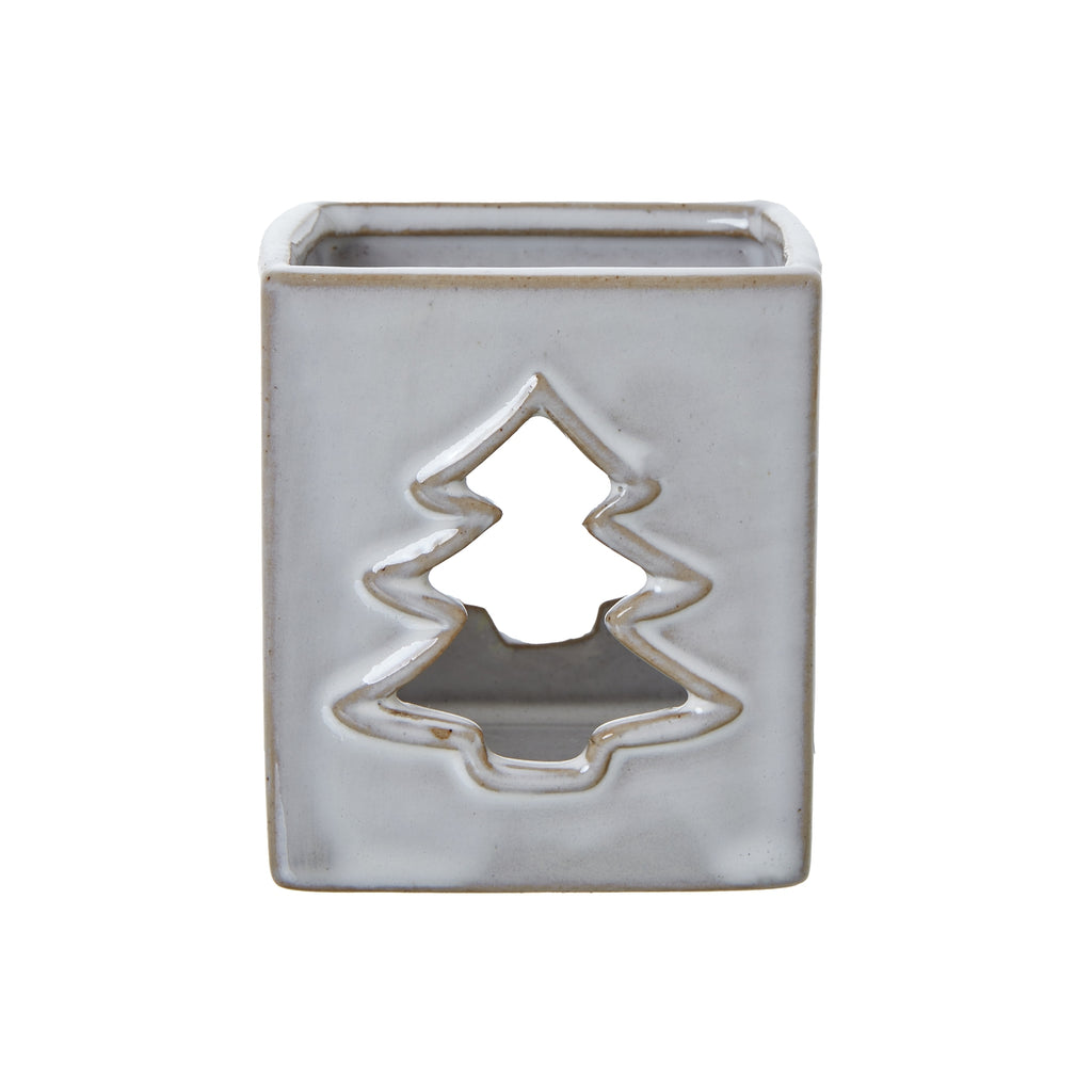 Front view of the off-white square candle holder with a tan-edged tree cut-out and open top.