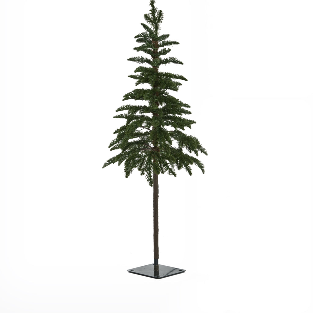 Green artificial woodland Christmas tree with sparse branches, a long brown trunk and a dark square base against white.