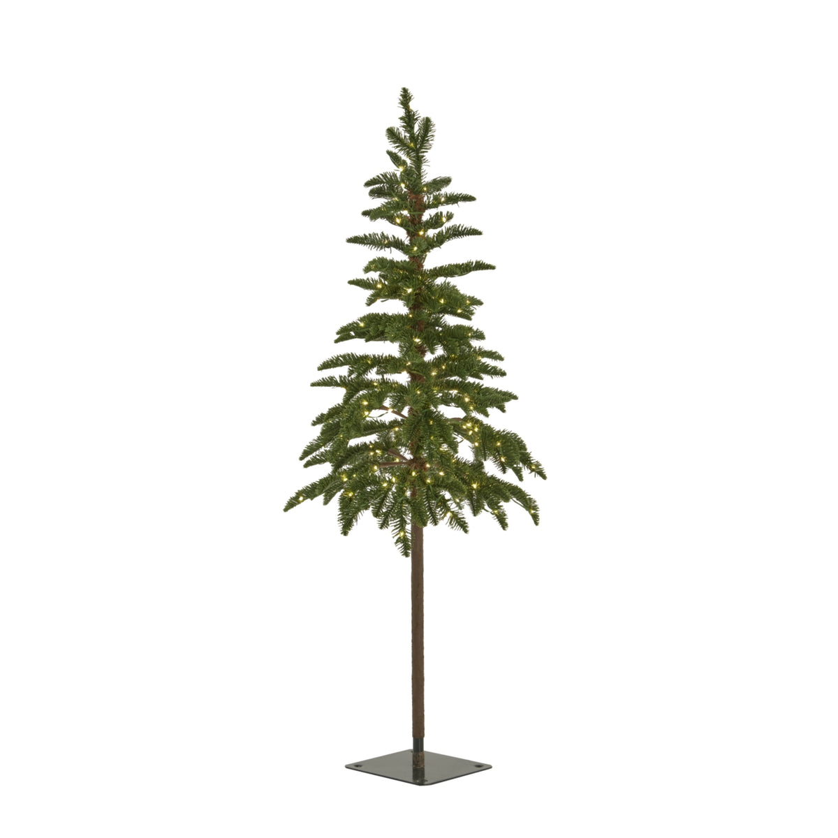 Artificial woodland Christmas tree shown with warm lights among its green branches above an exposed trunk and square dark base.