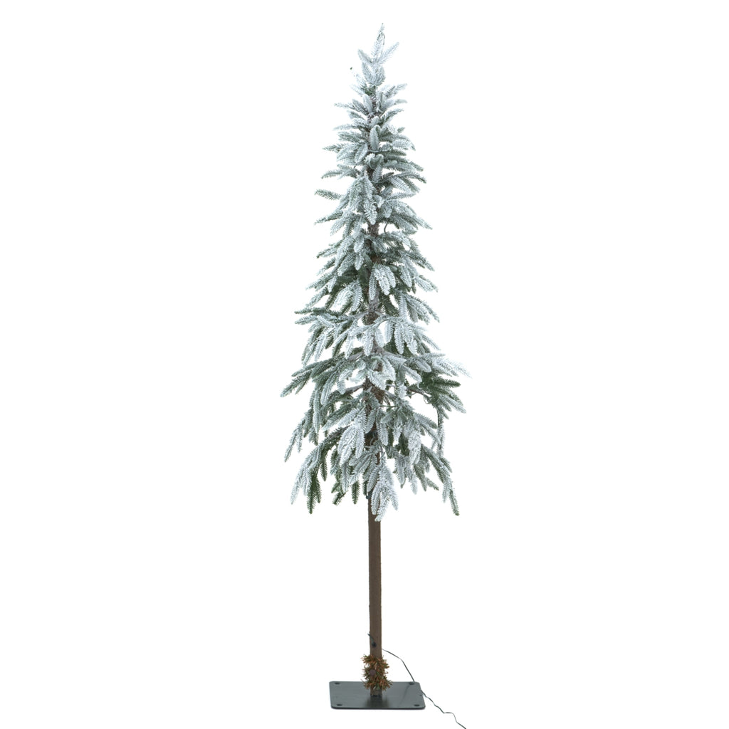 Snow-dusted artificial Christmas tree with no lights visibly glowing, a long brown trunk and a dark square base with a cable trailing to the right.