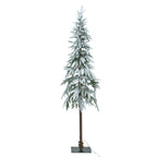 Snow-dusted artificial Christmas tree with no lights visibly glowing, a long brown trunk and a dark square base with a cable trailing to the right.