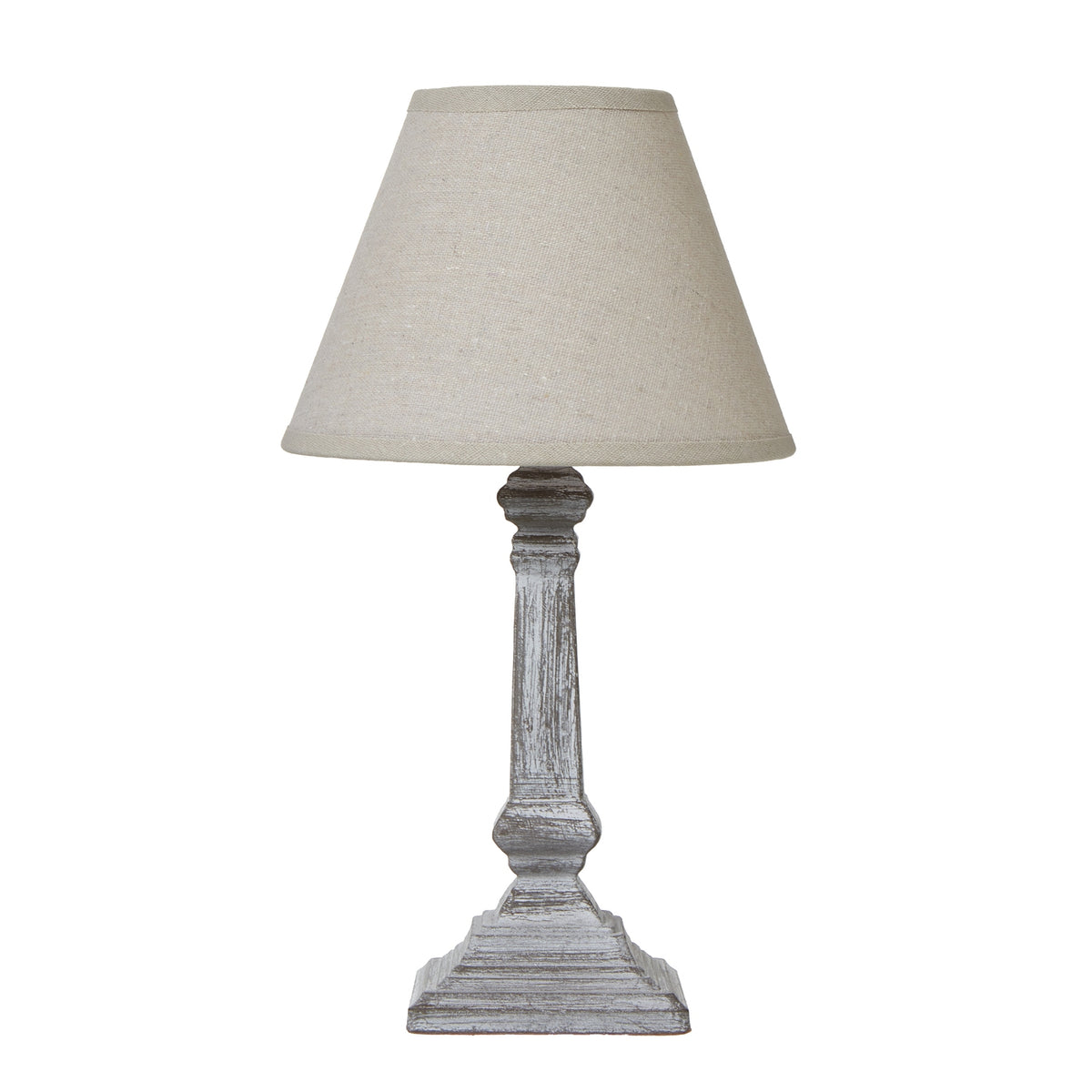 Table lamp with a tapered tan-coloured shade above a grey-brown column base with white highlights and a stepped square foot.