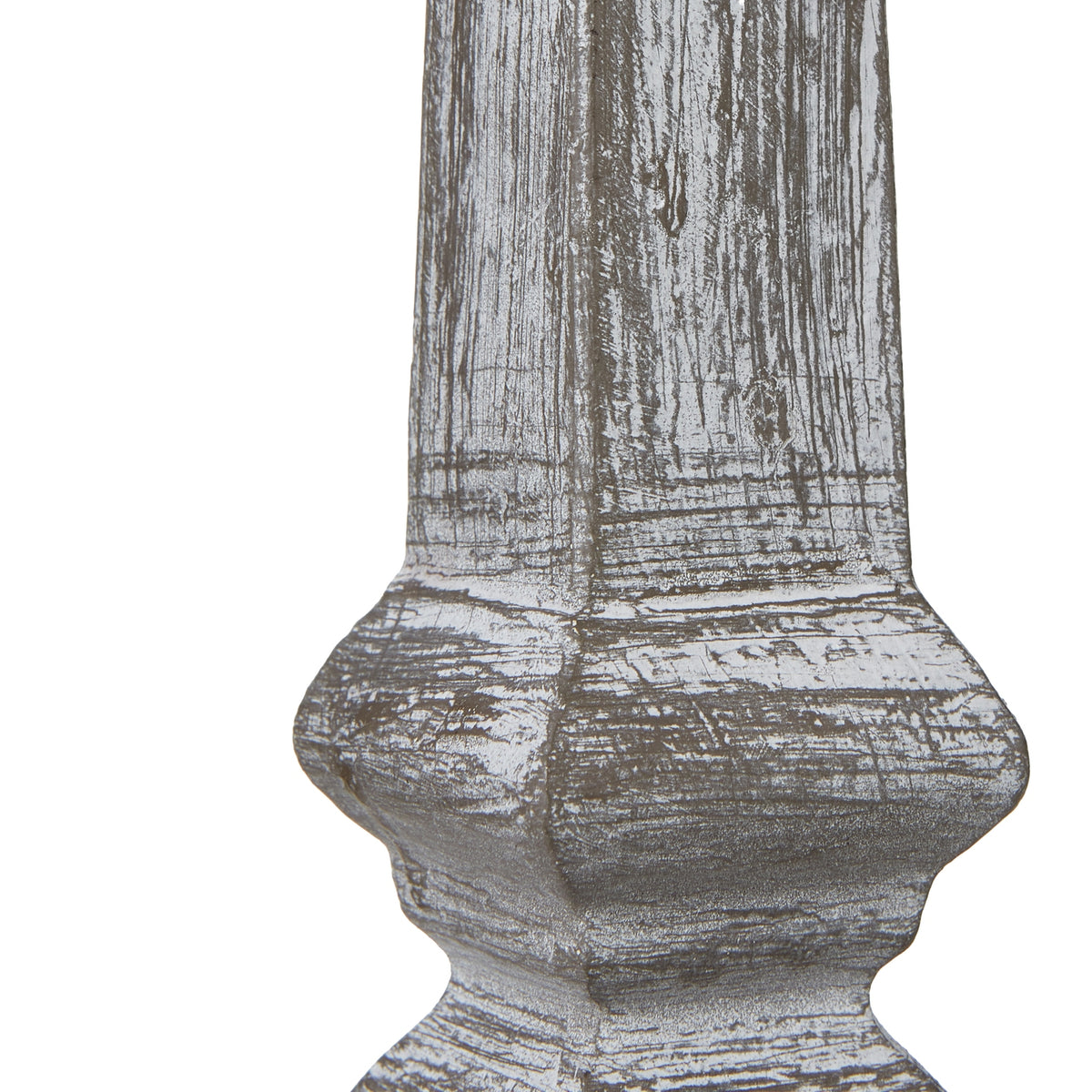 Close-up of the lamp's lower column, showing white surface markings across the grey-brown finish and its shaped contours.