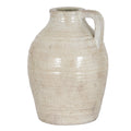 Pale cream decorative jug with beige mottling, a rounded body and a squared loop handle on the right.