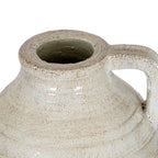 View from above of the jug's open neck, thick mottled rim and upper handle.