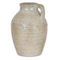 Pale cream decorative jug with warm brown mottling, a rounded shoulder, tapered body and squared loop handle on the right.