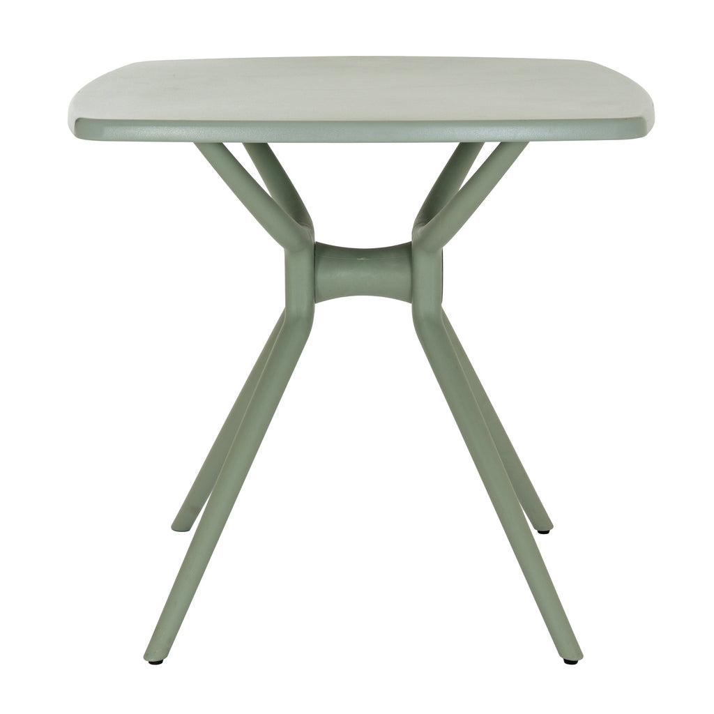 Side view of the French grey dining table, showing the curved central crosspiece between the splayed legs and the rounded edge of the tabletop.