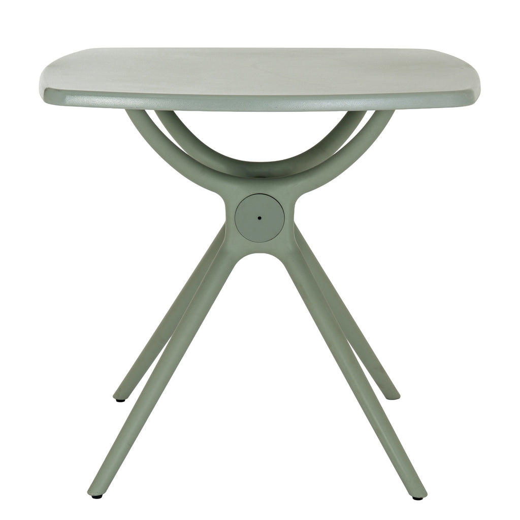 Straight-on view of the French grey dining table with sweeping supports beneath the top and a circular detail at the centre of the base.