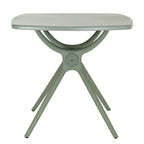 Straight-on view of the French grey dining table with sweeping supports beneath the top and a circular detail at the centre of the base.
