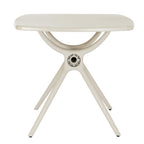 End view of the putty-toned dining table with curved braces beneath the top and a circular opening with visible fixings at the central hub.