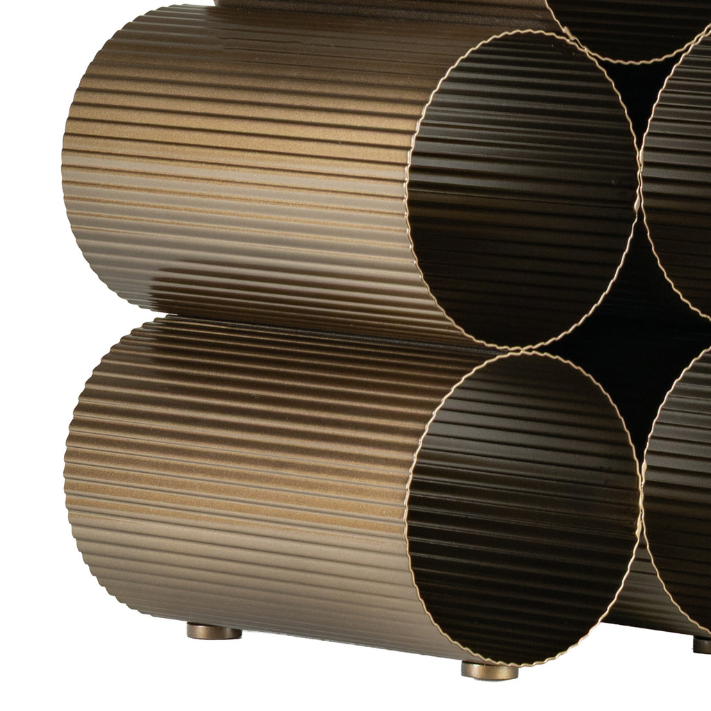 Close-up of the lower wine rack cylinders showing corrugated surfaces, rippled rims and small round feet.
