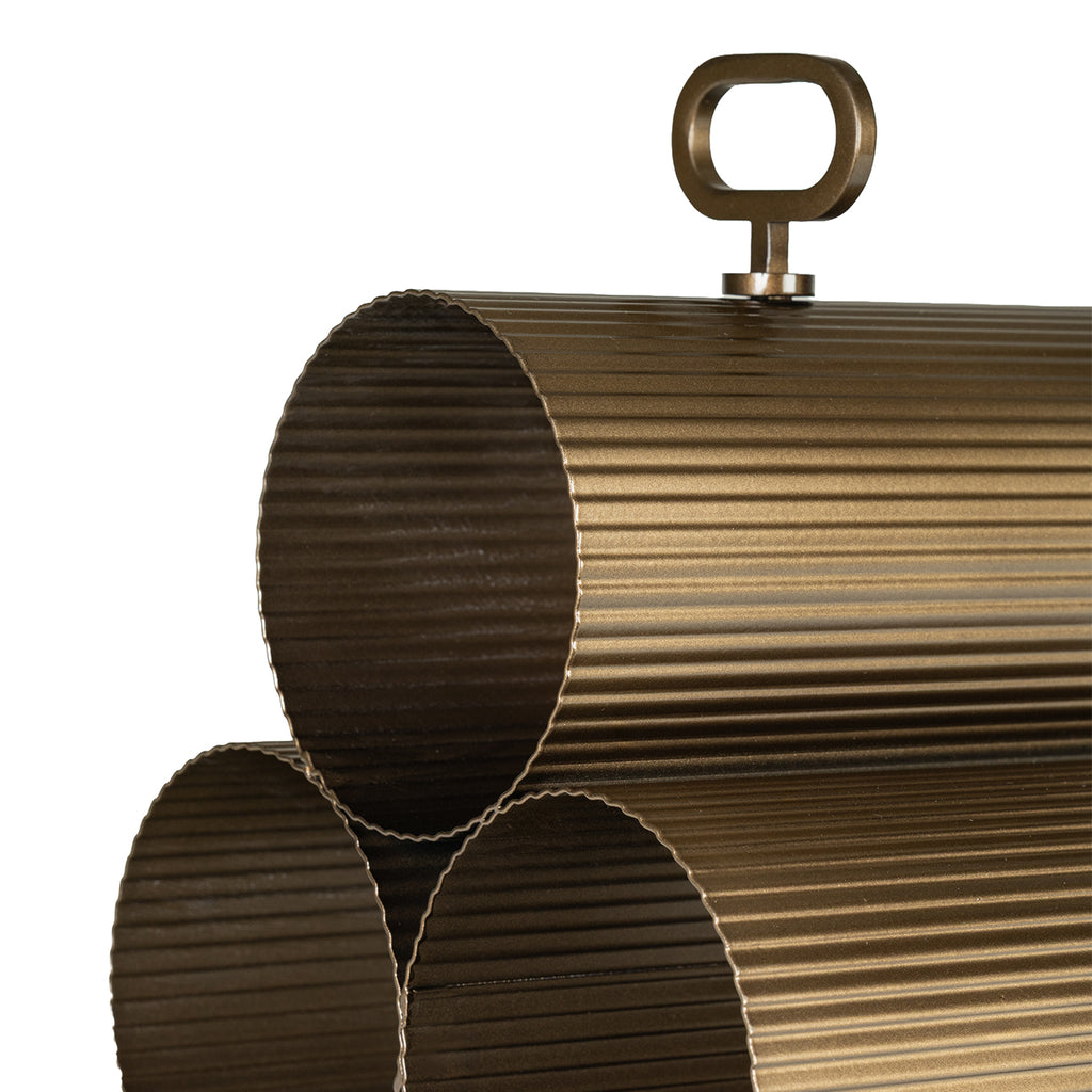 Detail of the top cylindrical holder and loop handle, with golden highlights along the fine metal ribs.