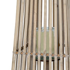 Detail of the transparent cylindrical holder behind the lantern's vertical slats and crossing band around the middle.