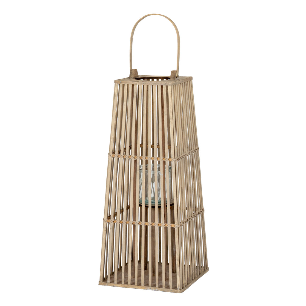 Full view of the tapered grey-brown lantern with three open-slat sections, a square base, arched handle and central cylindrical holder.
