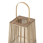 Close view of the lantern's arched handle above a square top with a round opening and vertical slats below.
