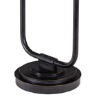 Close-up of the lamp's curved lower frame and tiered circular base, showing the dark finish and fine golden edges.