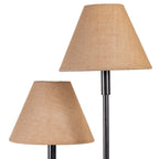 Detail of two natural-toned tapered lampshades, showing their woven fabric texture and different heights above the dark stems.