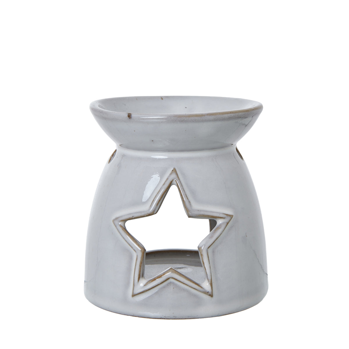 Front view of an off-white wax warmer with a large outlined star opening and a shallow bowl at the top.