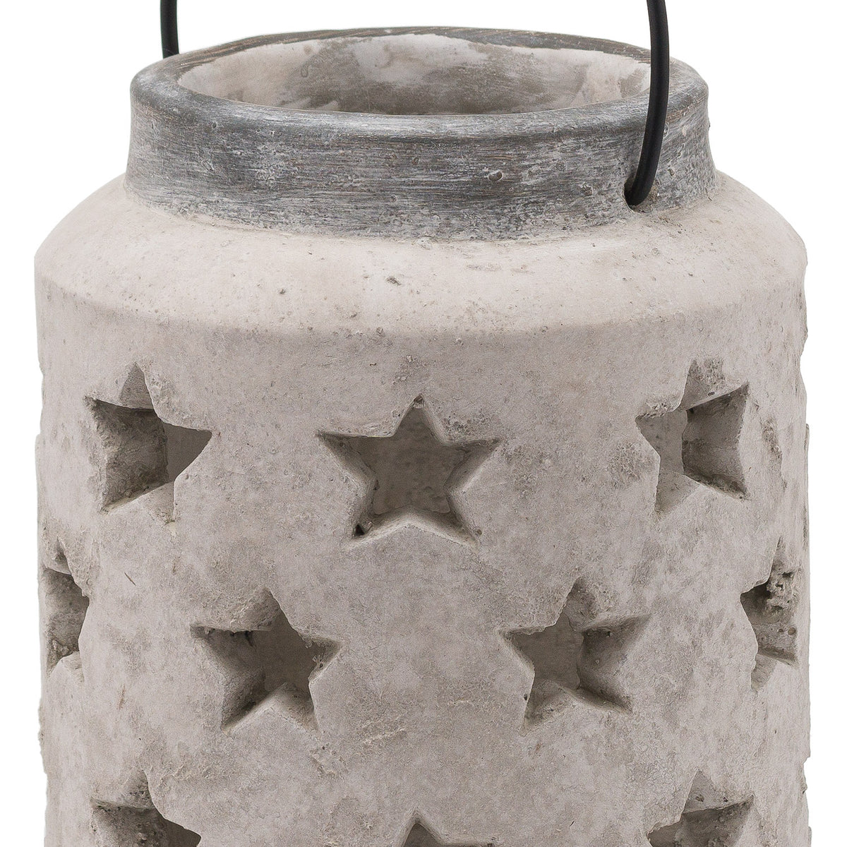 Close-up of the lantern's star-shaped openings, uneven pale surface and dark grey neck, with the open top and sides of the black handle visible.