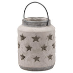 Full view of a pale mottled cylindrical lantern with rows of star cutouts, a dark grey rim and base, and a black arch handle.