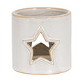 Cream-white cylindrical candle holder viewed slightly from above, showing a tan-edged star opening and open rim.