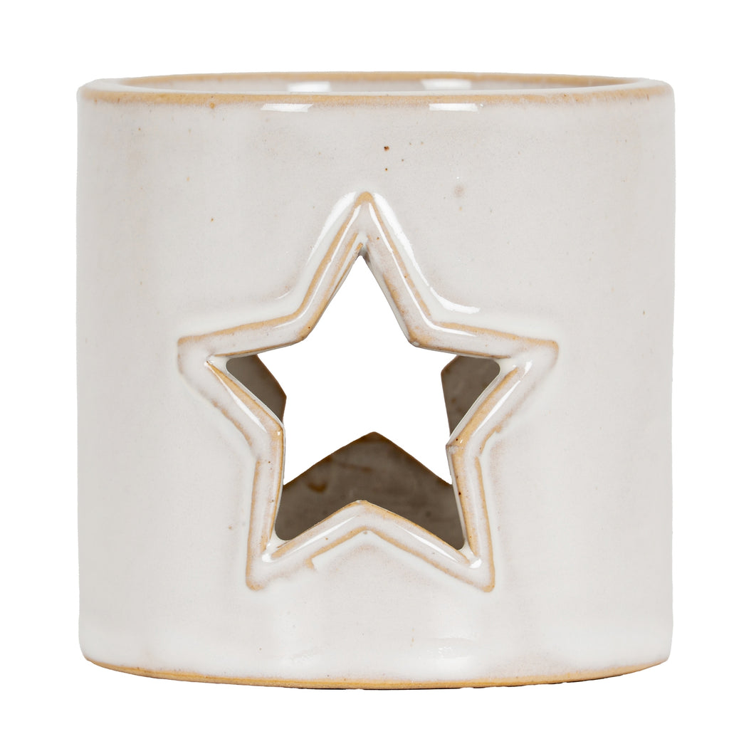 Straight-on view of the glossy cream-white candle holder with a central star cut-out, tan outlines and scattered small speckles.