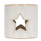 Straight-on view of the glossy cream-white candle holder with a central star cut-out, tan outlines and scattered small speckles.