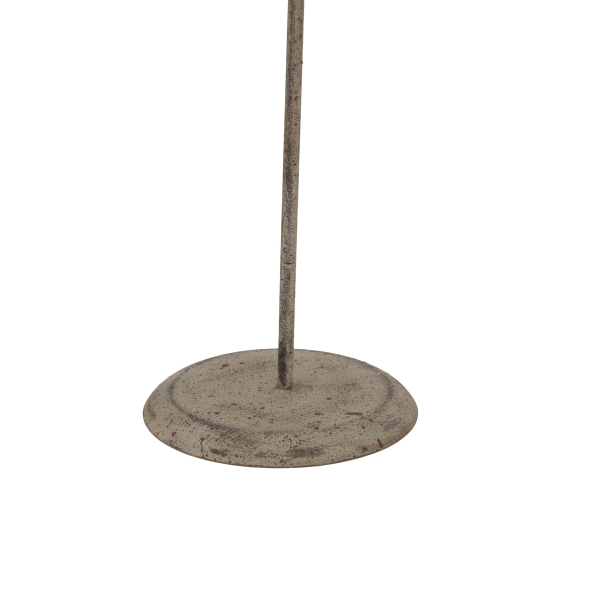 Detail of the ornament's slender stem and round base, showing a mottled grey-brown finish and scattered reddish marks.